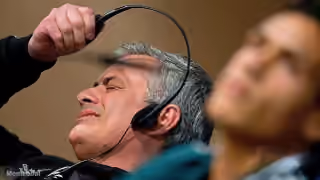 Guy Pulling Off His Headset in Disgust