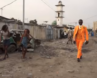 Guy With Fresh Bright Orange Suit in Slums