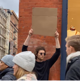 Guy with sign