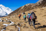 Hikers Trudging Up A Mountain