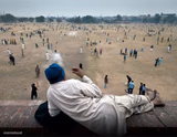 Indian guy watching crowd