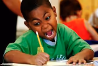 Intensely Writing Kid