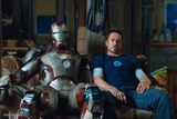 Iron Man 3 Tony Stark sitting next to Mark 42 suit