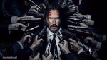 John Wick surrounded by guns