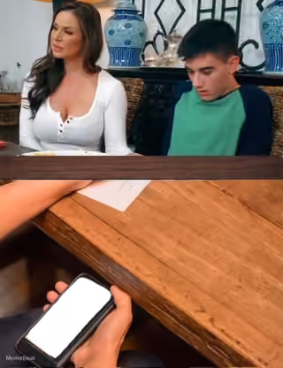 Jordi Looking at Phone Under Table