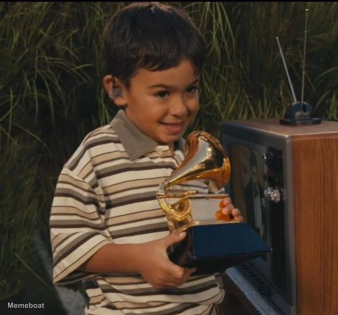 Kid Holding a Grammy Super Bowl - meme generator image preview