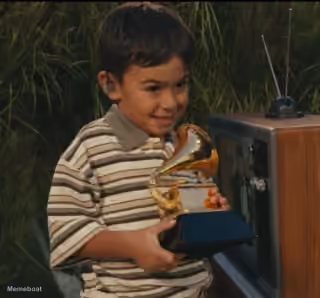 Kid Holding a Grammy Super Bowl