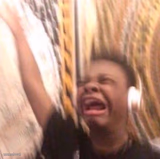 kid listening to music screaming with headset