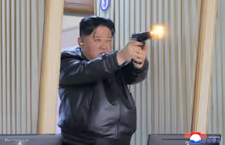 Kim Jong UN Firing a Pistol