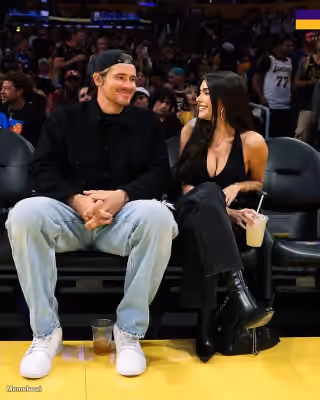 Madison Beer Looking at Justin Herbert