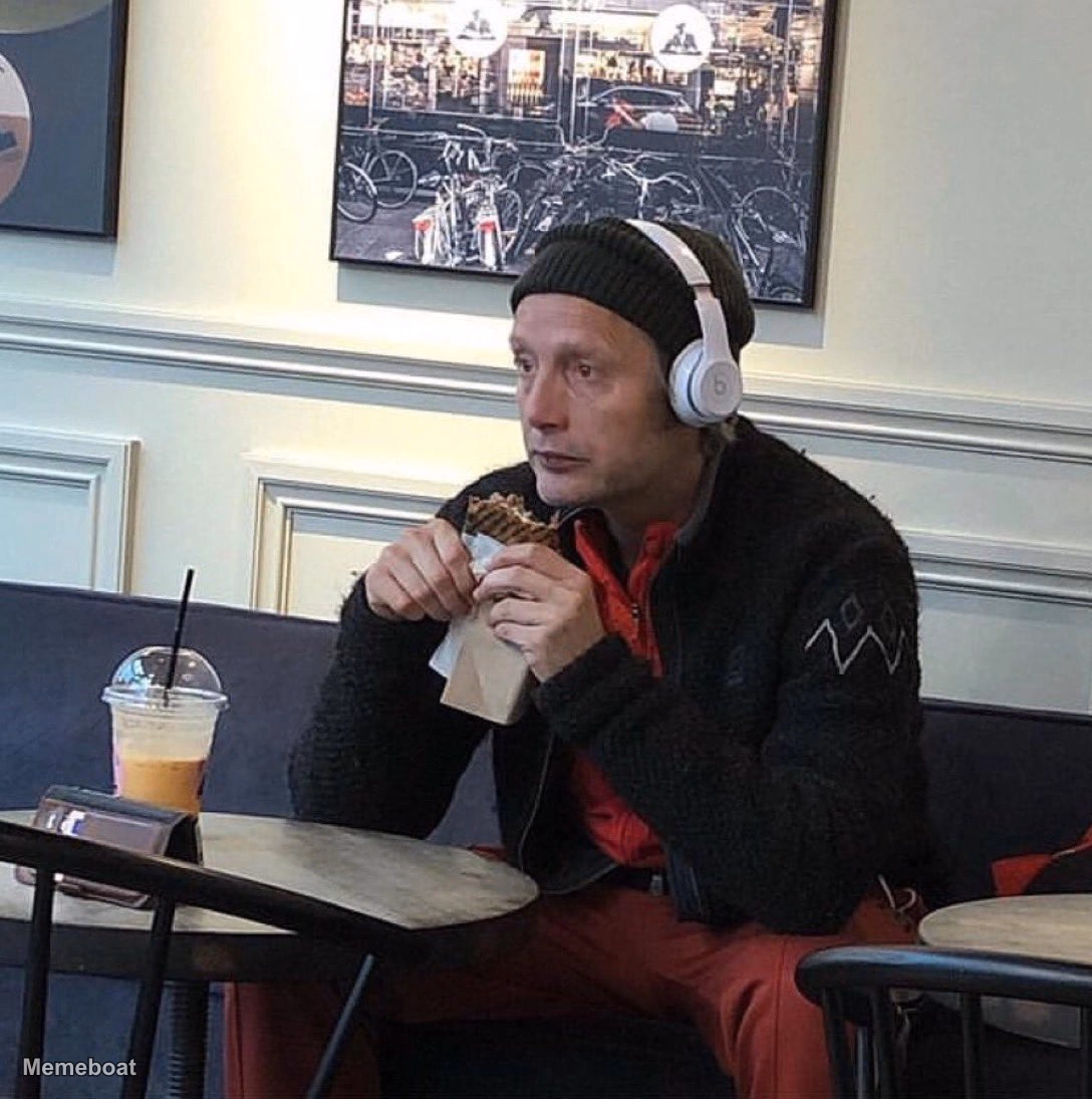 Mads Mikkelsen Eating With Headphones - meme generator image preview