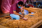 man carving table