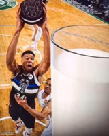 man dunking oreos in milk