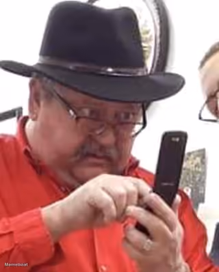 Man in Fedora Using Phone