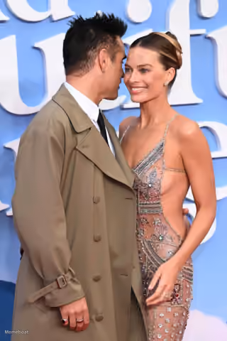 Margot Robbie and Tom Ackerley Smiling
