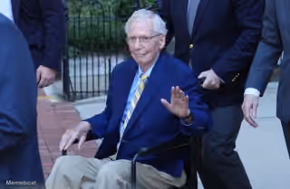 Mitch McConnell Waving From Wheelchair
