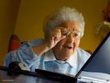 Old lady at computer finds the Internet
