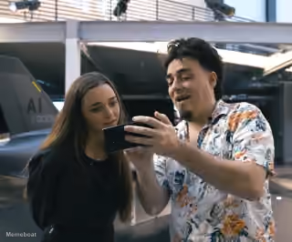 Palmer Luckey Showing Phone to Molly O'Shea