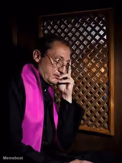 Pensive Priest in Confessional
