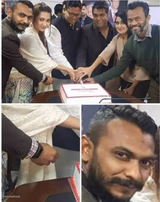 People cutting cake