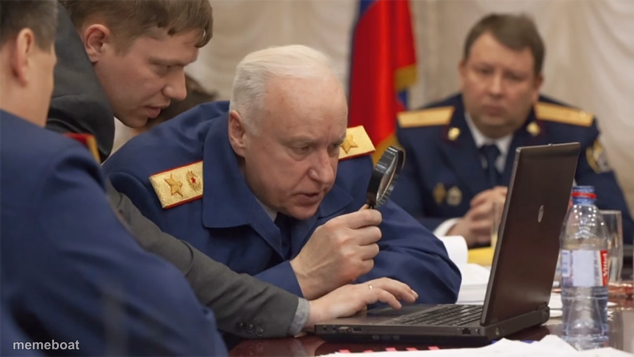 Russian general looking at laptop with magnifying glass - meme generator image preview