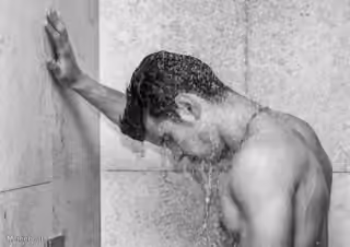 Sad Man in Shower