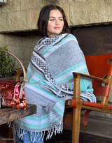 Selena Gomez wrapped in a blanket