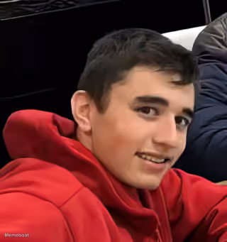 Smiling Boy in Red Hoodie