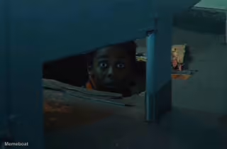 Stranger Things Lucas Sinclair Peeking Through a Hole