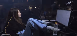 Trader Jadoodoo with her feet up on a desk