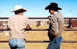 Two cowboys talking