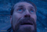 Willem Dafoe looking up
