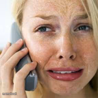 Woman crying on cell