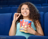 Woman eating popcorn
