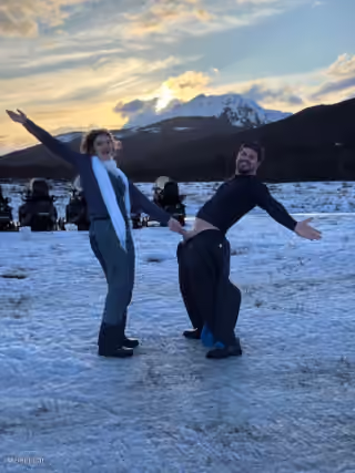 Woman holding a guy by his pp pose