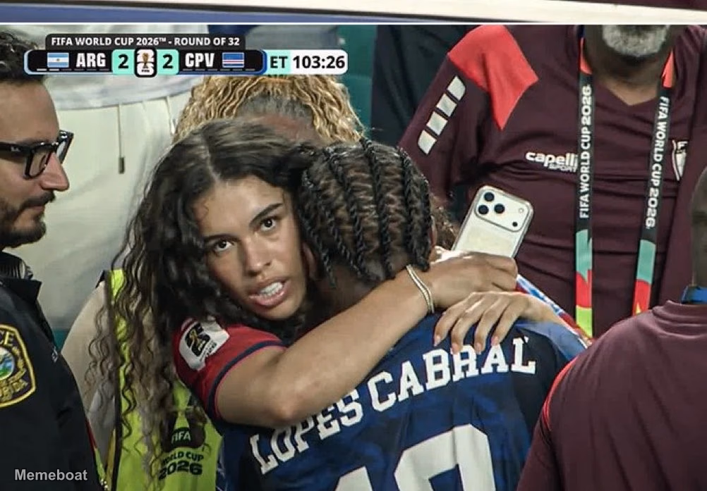 Woman With Intense Look Hugging Lopes Cabral - meme generator image preview