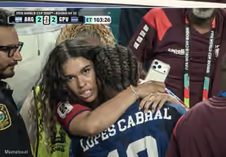 Woman With Intense Look Hugging Lopes Cabral