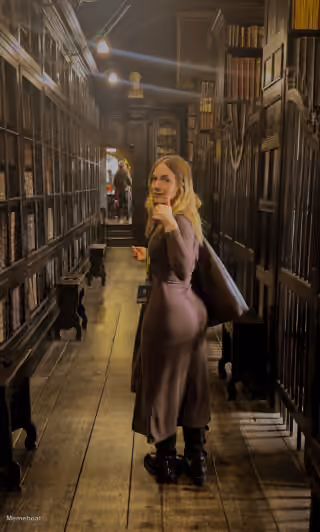 Young Woman Thumbs Up in Library