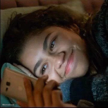 Zendaya smiling looking at phone - 'Euphoria' - meme generator image preview