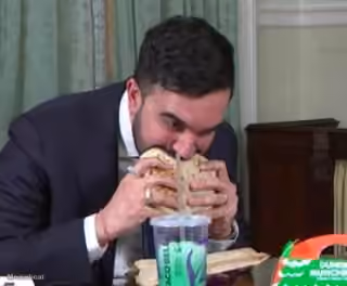 Zohran Mamdani Devouring His Crunch Wrap Supreme