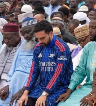 Zohran Mamdani Doing Prayer Wearing an Arsenal Jersey