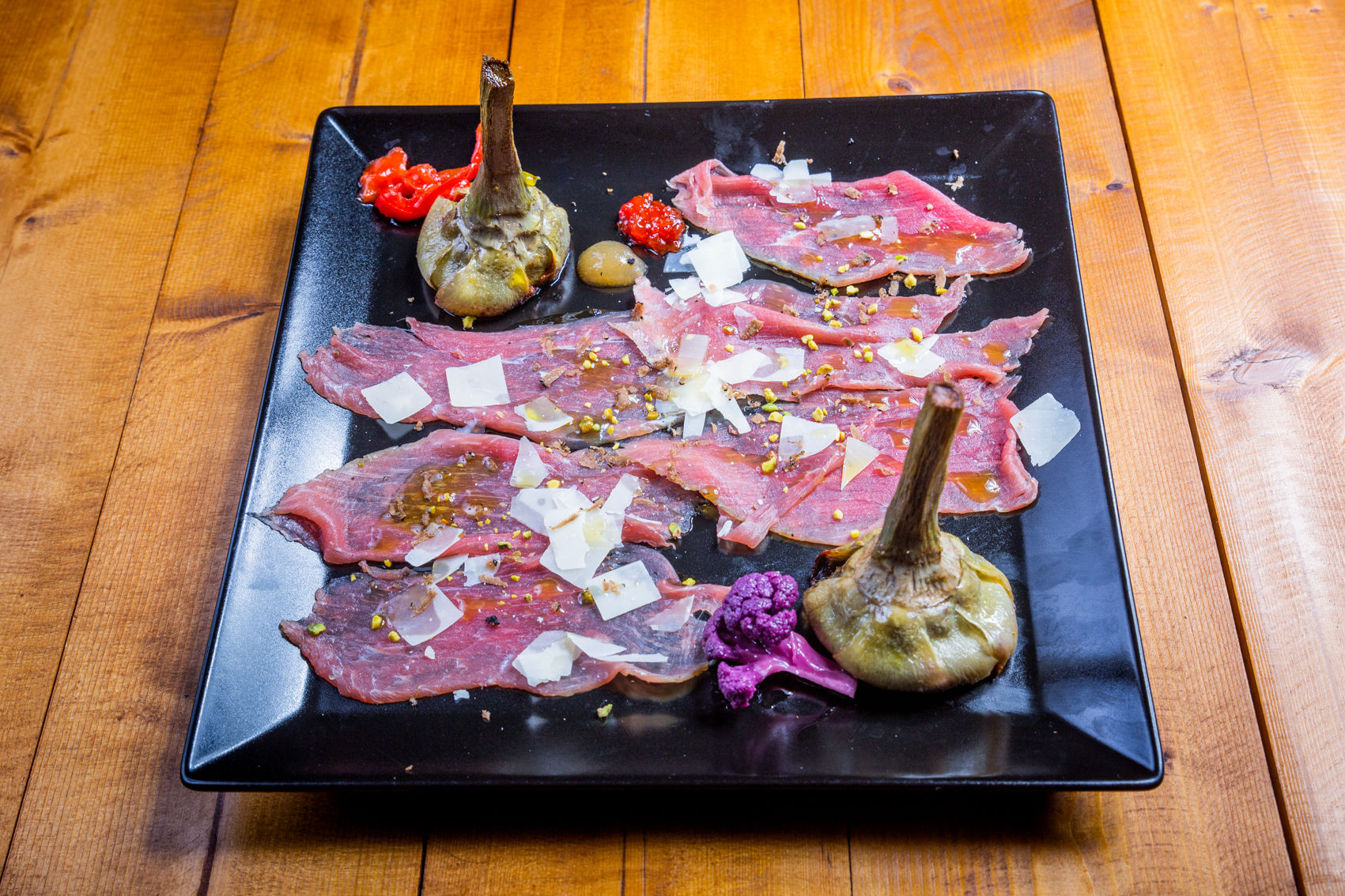 Carpaccio Di Magatello Al Montepulciano Con Carciofi Alla Giudia E Scaglie Di Grana