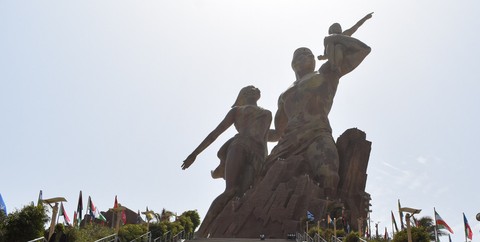The African Renaissance Monument in Dakar against a bright sky
