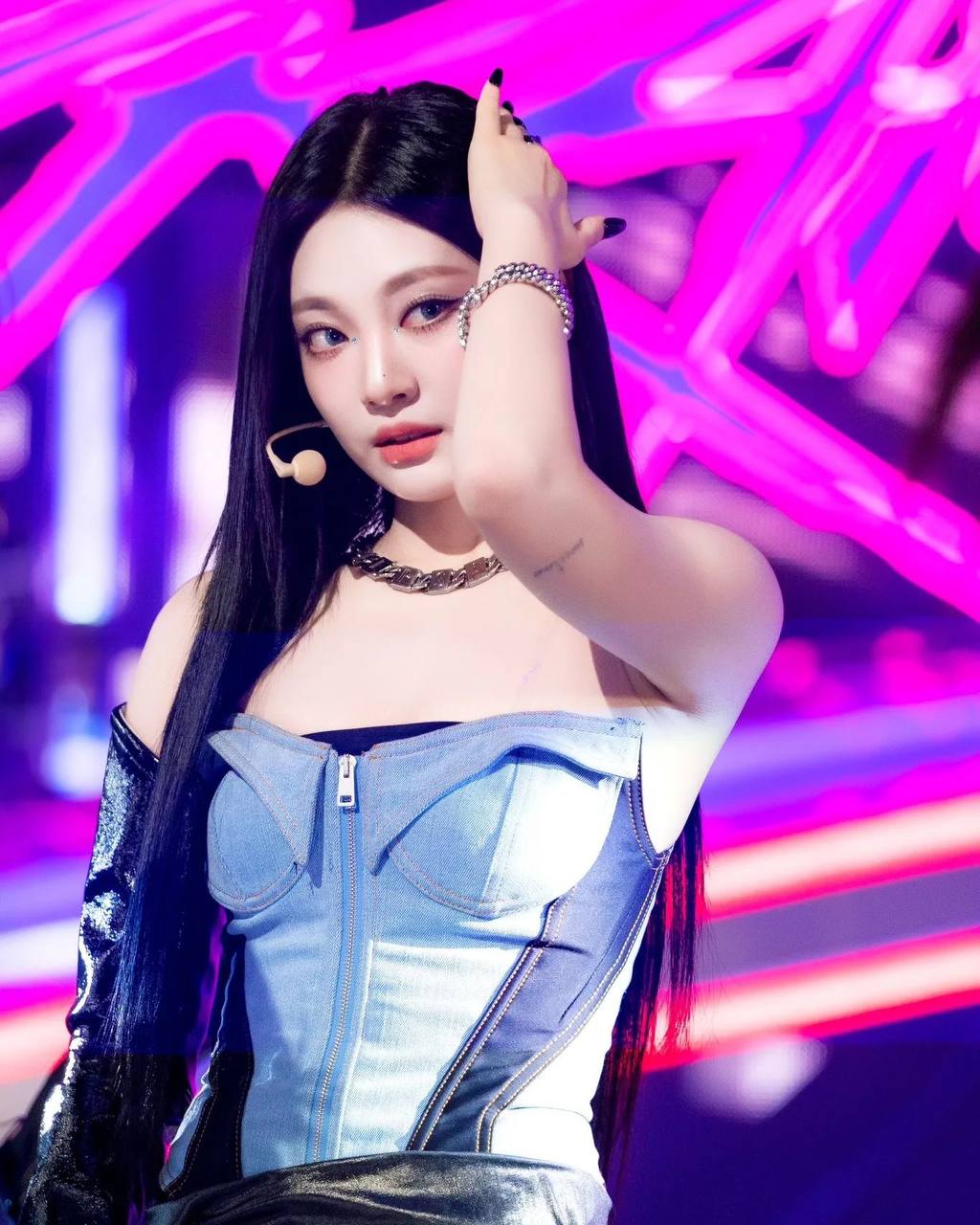 Winter's Fiery Stage Presence: A Denim Dream in Purple Lights