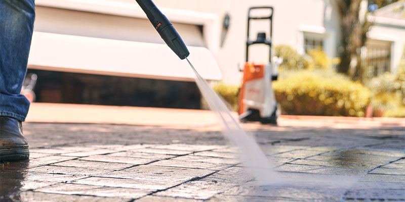 Using a STIHL pressure washer with rotary nozzle to clean outdoor area