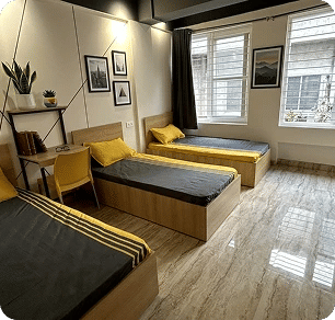 Triple sharing room with three beds