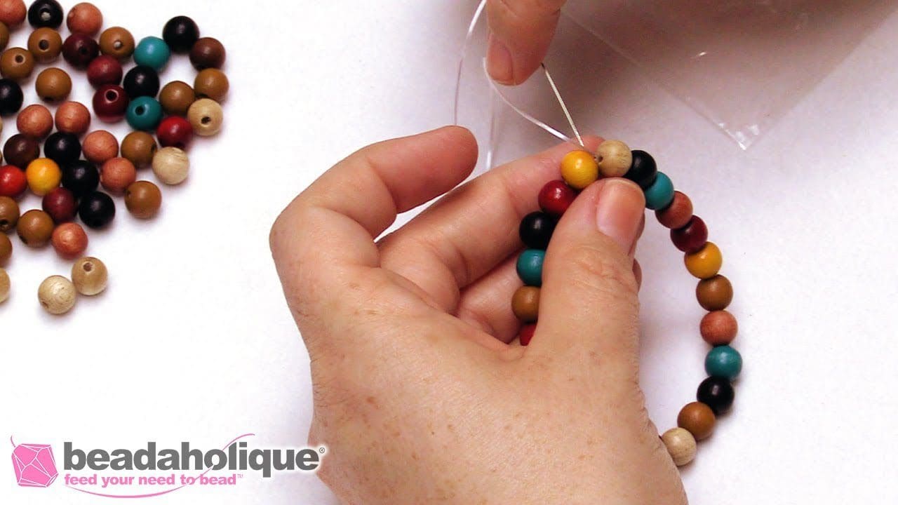 How to Secure a Stretch Cord Bracelet - DIY jewelry making video