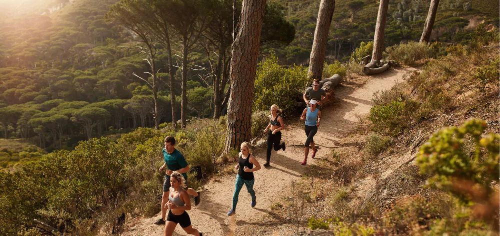 Group running on mountain track