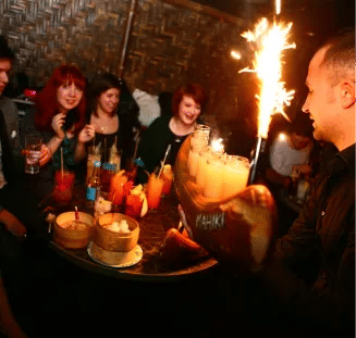 People being served cocktails at an event
