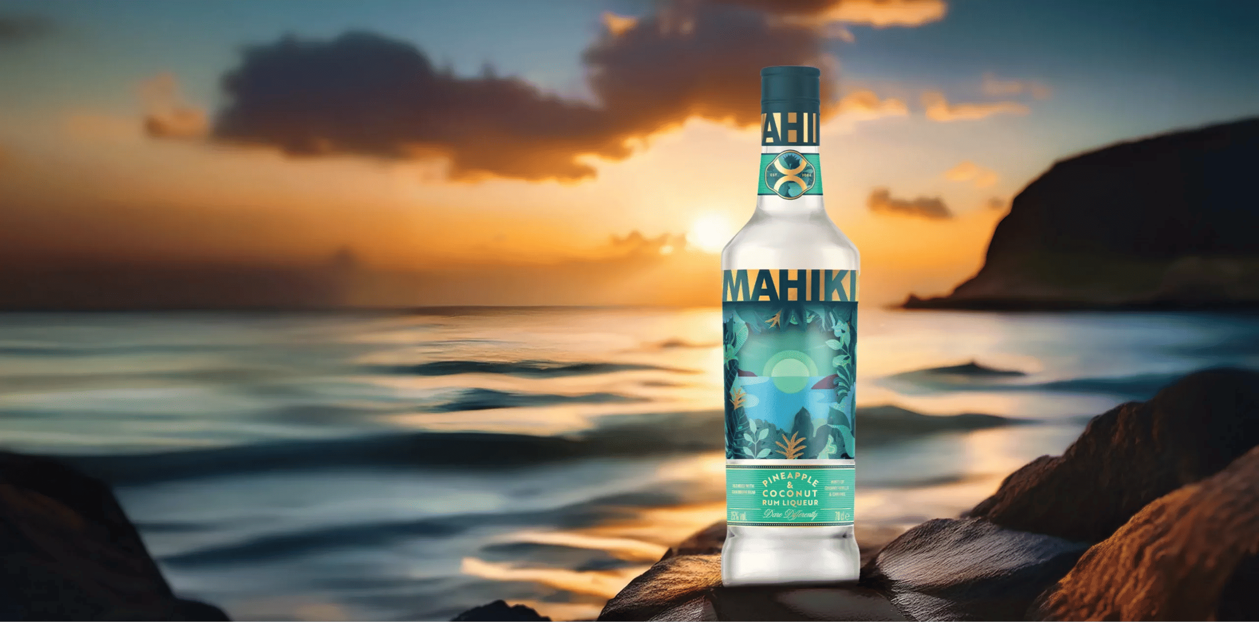 Mahiki Pineapple & Coconut rum bottle in front of sunset